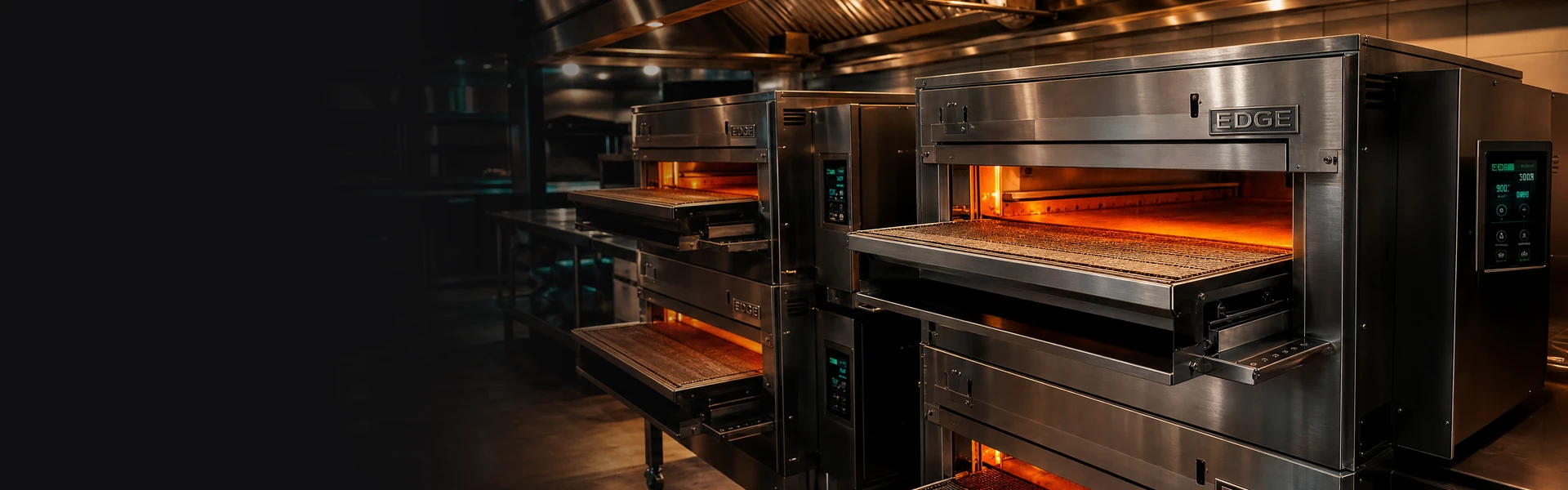 EDGE commercial conveyor pizza ovens in a stainless kitchen